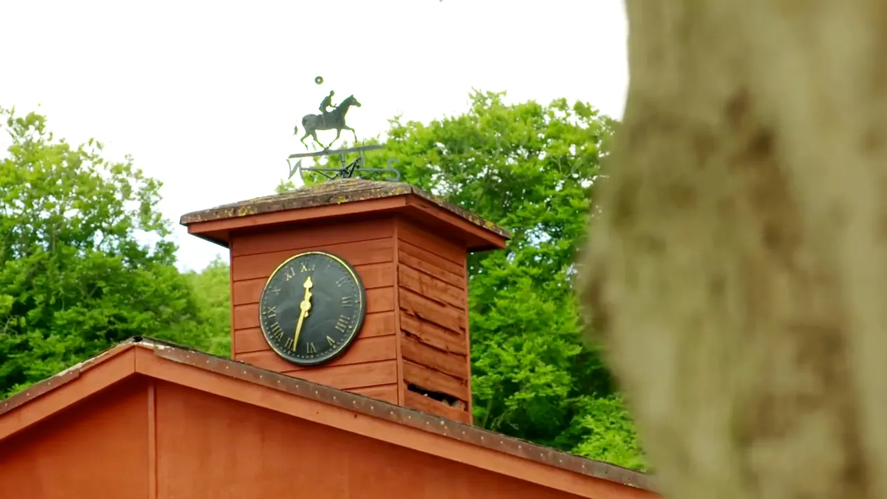 The stable clock tower, topped with a racehorse-and-jockey weathervane