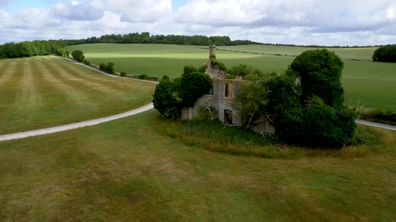 The ivy-covered ruins of the old Stockbridge Racecourse grandstand, surrounded by gallops